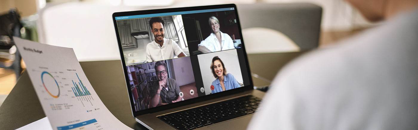 Employee working remotely on video call with co-workers