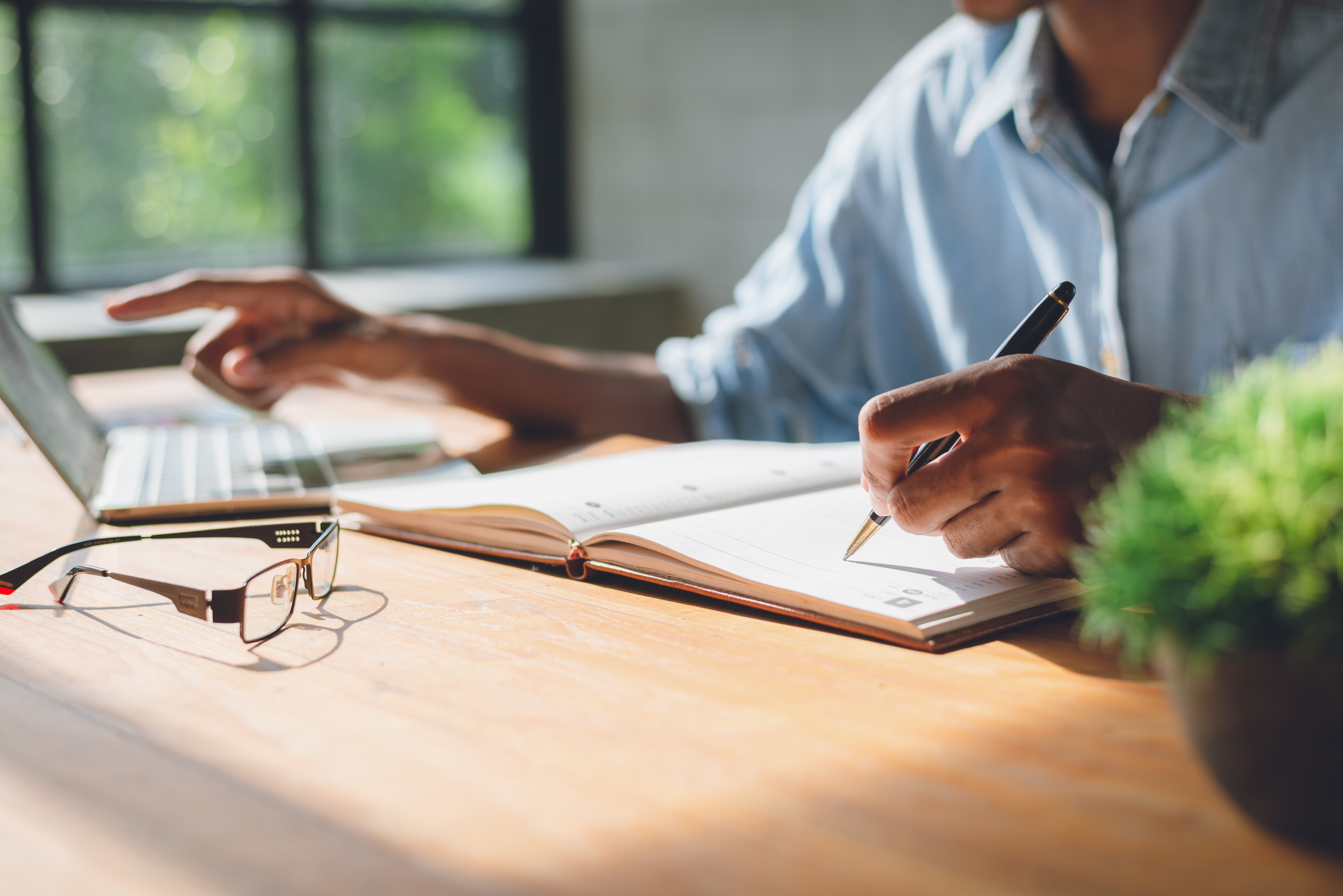 Business person writing list