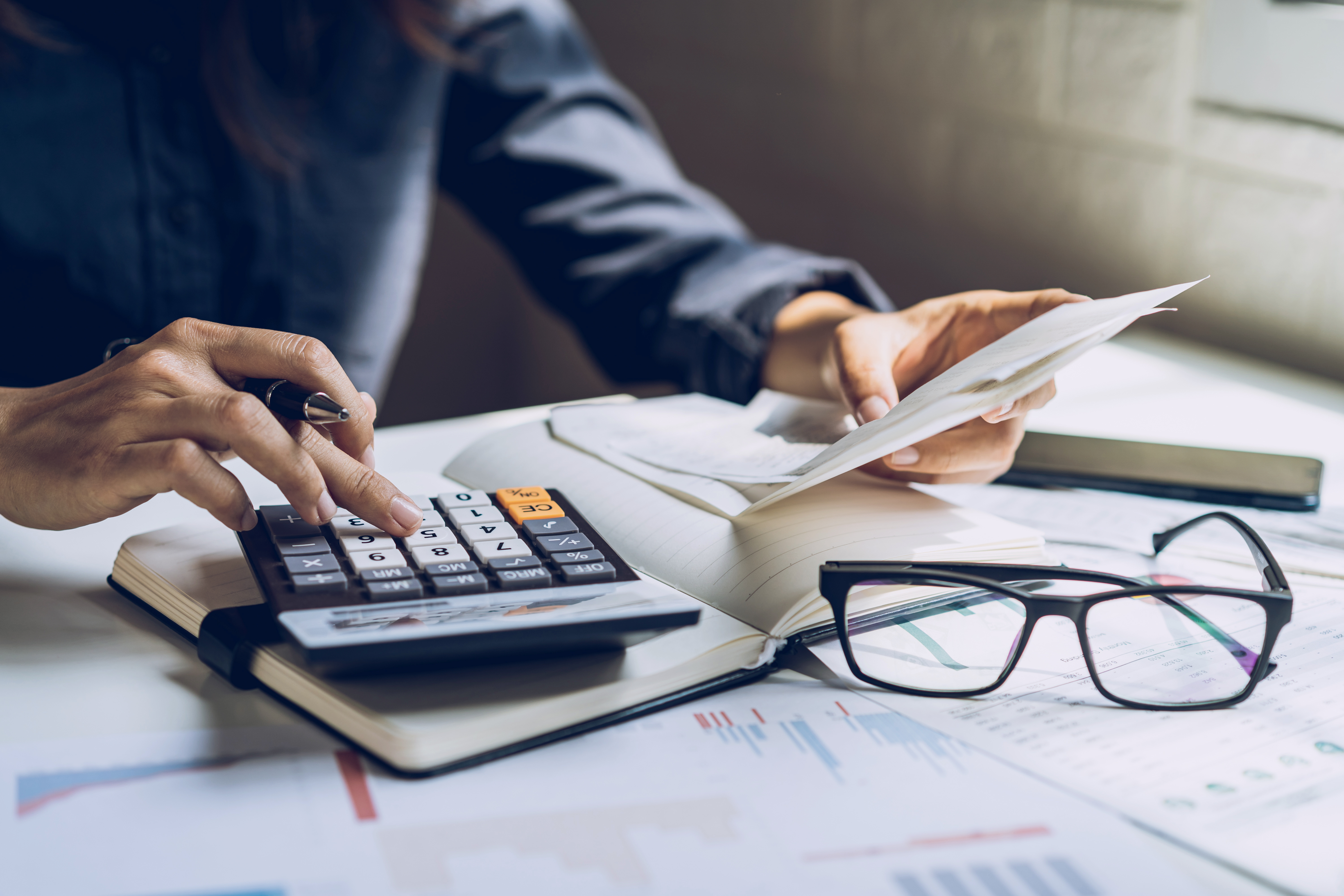 Accounting services professional calculating taxes