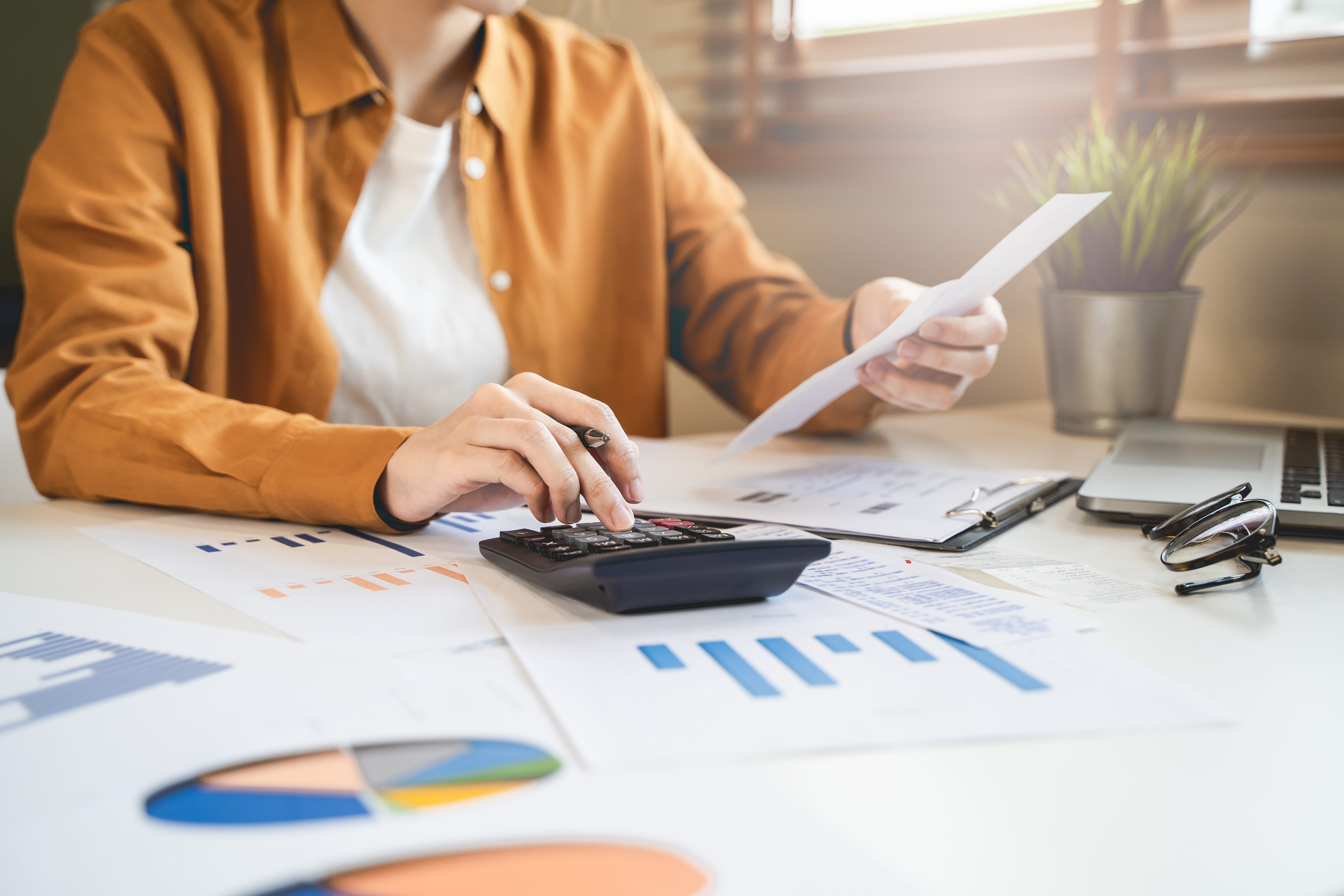 Small business owner reviewing reports